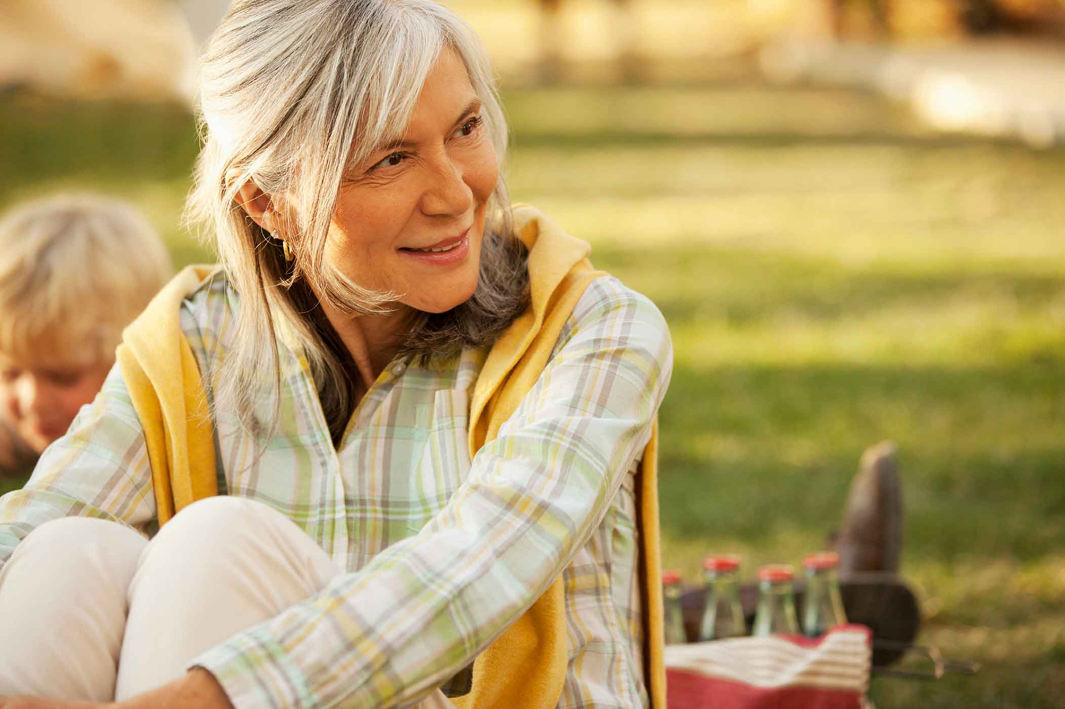 Smiling older woman relaxing outdoors